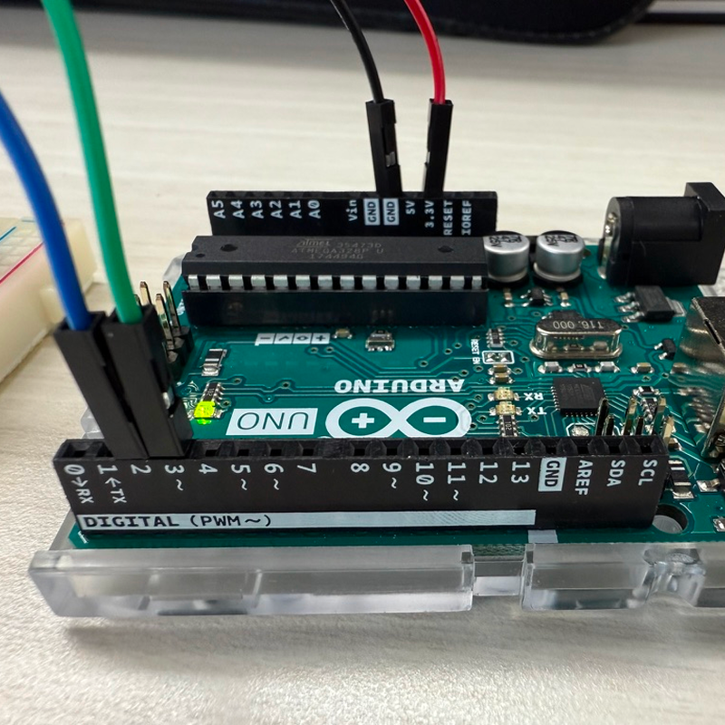 Connecting the circuit following the diagram and experimenting with different inputs.