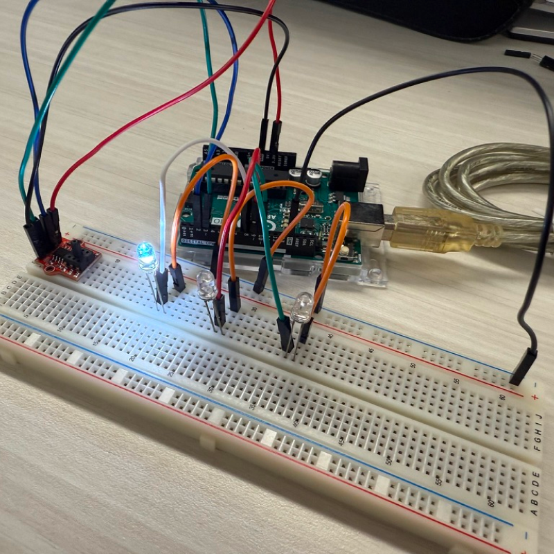 Adding LED lights onto the breadboard.